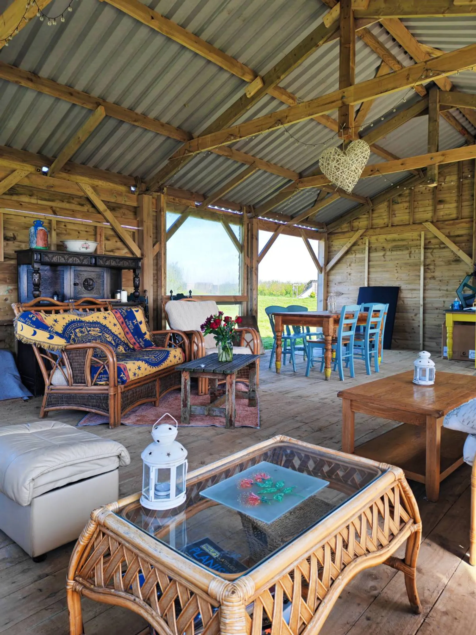 Inside The Coffee Room at West Kellow Yurts: soft light, comfortable seating, vase of fresh flowers